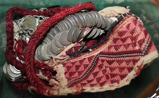 Eastern dowry headress, having geometric woven cotton band hung with white metal coins and chains